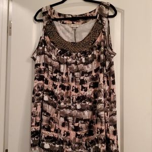 Sleeveless blouse with beading around neckline